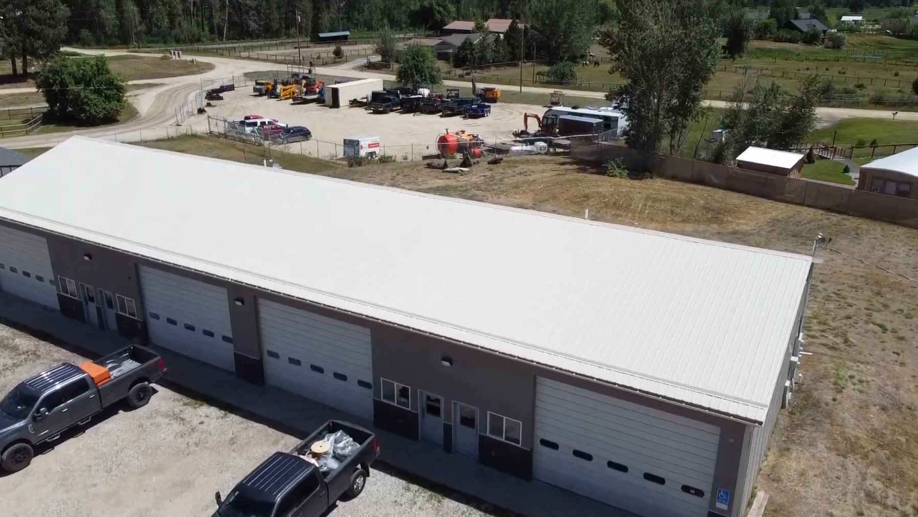 Aerial view of Bitterroot Industrial Park showing the flex buildings, the gravel drive, and the yard.